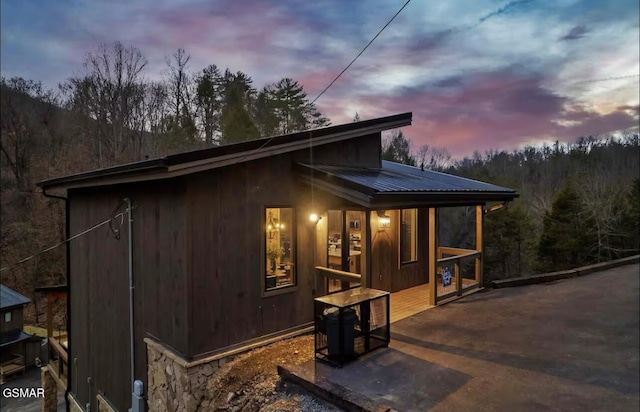 view of property exterior with metal roof