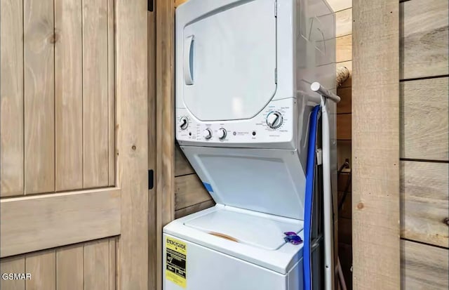 laundry room featuring stacked washing maching and dryer