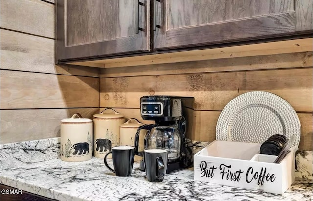 interior details featuring light countertops and dark brown cabinets