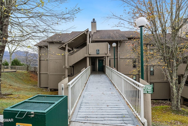 rear view of house featuring a mountain view and cooling unit