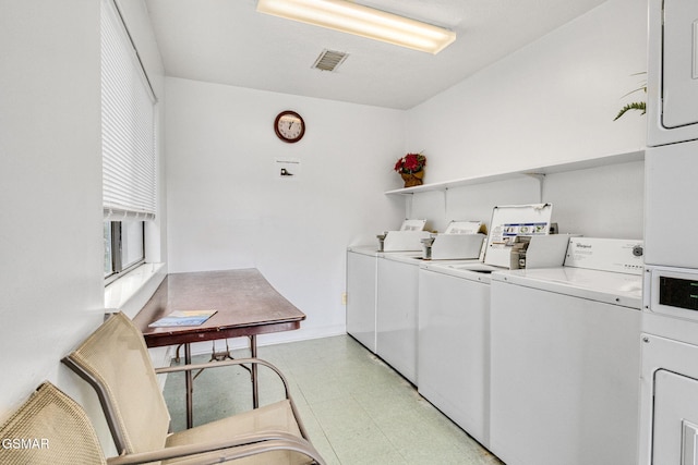 washroom with washer and dryer and cooling unit