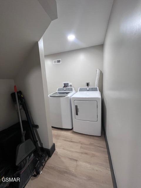 2359 Grassy Branch Rd, Sevierville, TN 37876 - washroom with separate washer and dryer and light wood-style flooring