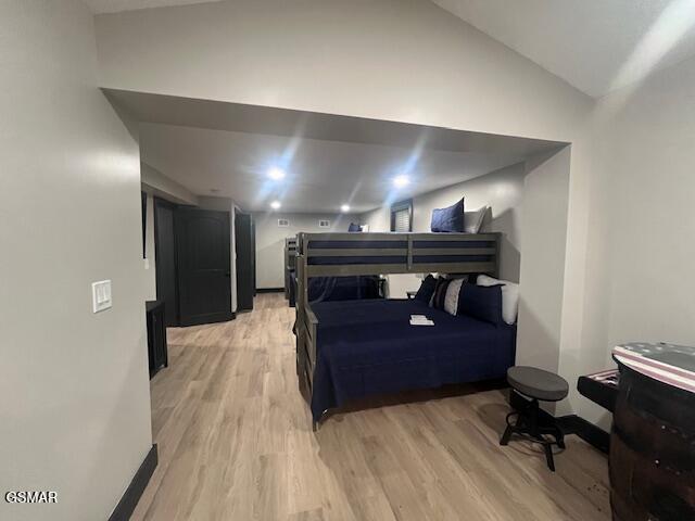 2359 Grassy Branch Rd, Sevierville, TN 37876 - bedroom featuring lofted ceiling and light wood finished floors