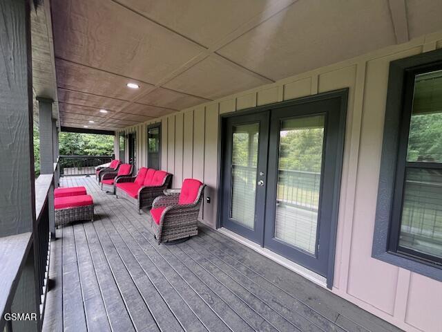 2359 Grassy Branch Rd, Sevierville, TN 37876 - wooden terrace with french doors and an outdoor hangout area