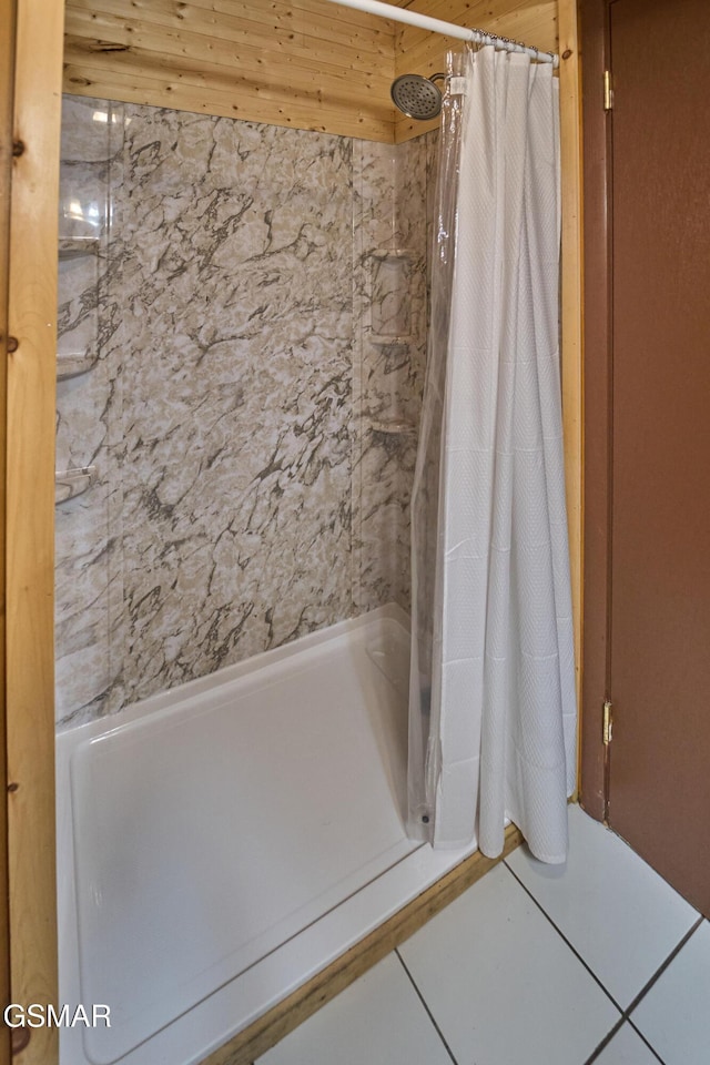 bathroom with tile patterned floors and a shower with shower curtain