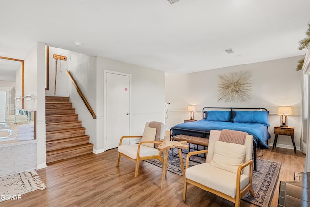 1452 N Arbon Ln, Gatlinburg, TN 37738 - bedroom featuring light wood-type flooring and baseboards