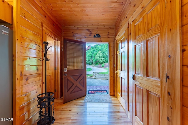 655 Stockton Dr, Sevierville, TN 37876 - entrance foyer with wood walls, light wood-type flooring, and wood ceiling