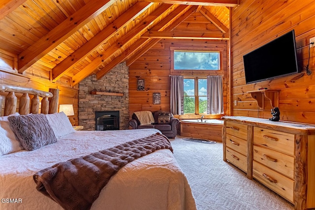 655 Stockton Dr, Sevierville, TN 37876 - bedroom featuring wooden walls, light colored carpet, wood ceiling, and a fireplace