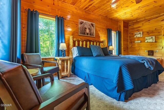 655 Stockton Dr, Sevierville, TN 37876 - bedroom featuring wood walls, carpet flooring, and wood ceiling