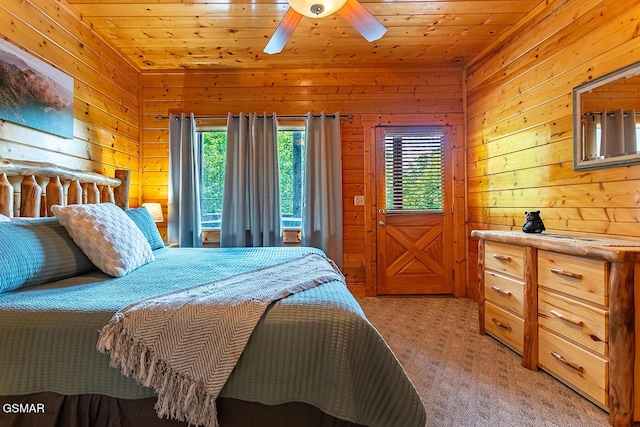 655 Stockton Dr, Sevierville, TN 37876 - bedroom featuring light carpet, wood walls, wood ceiling, and a ceiling fan