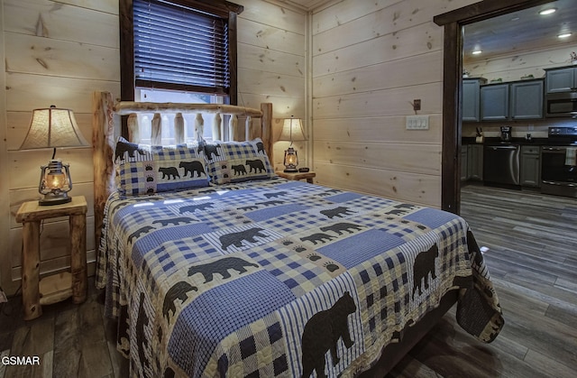 bedroom with dark hardwood / wood-style floors and wood walls