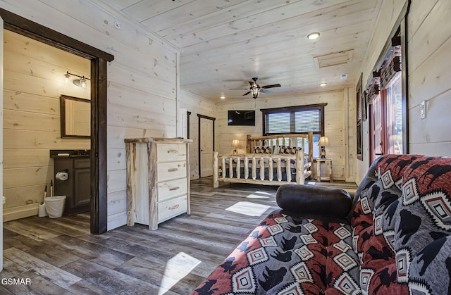 bedroom with wood walls, dark hardwood / wood-style flooring, and wood ceiling