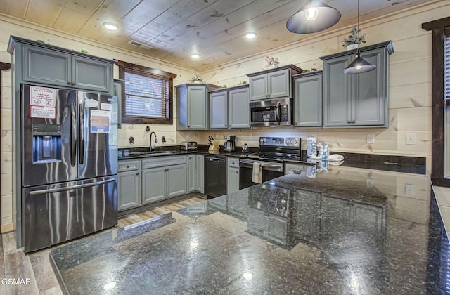 kitchen featuring pendant lighting, wooden ceiling, sink, appliances with stainless steel finishes, and wood-type flooring