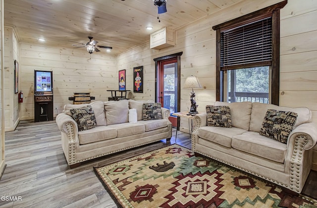 living room with a wealth of natural light, ceiling fan, wood ceiling, and light wood-type flooring