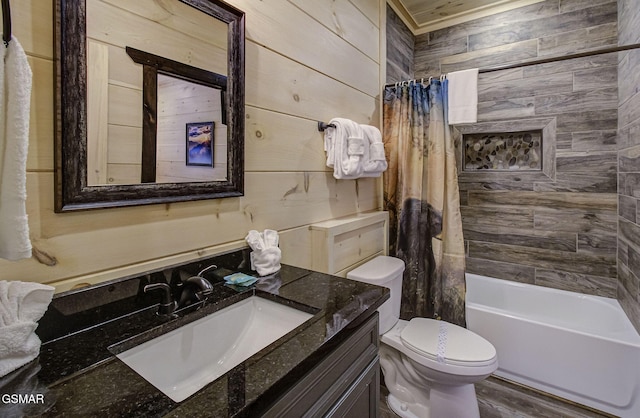 full bathroom with shower / bath combo, ornamental molding, vanity, wooden walls, and toilet