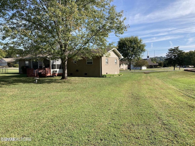 view of yard featuring a wooden deck