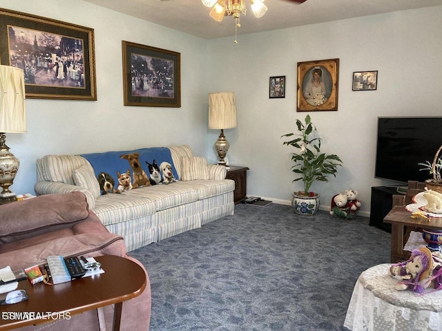 carpeted living area featuring ceiling fan and baseboards