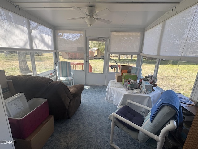 sunroom / solarium featuring ceiling fan