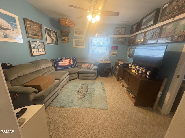 living room with light carpet and ceiling fan