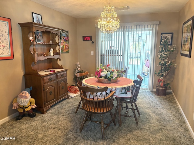 dining area featuring visible vents, baseboards, a notable chandelier, and carpet flooring