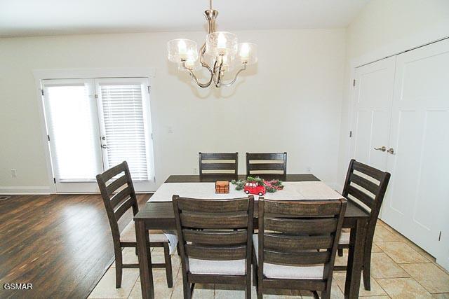 dining room with a healthy amount of sunlight and a notable chandelier