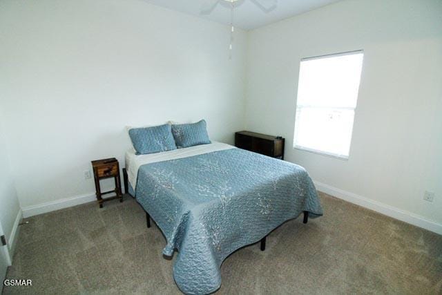 carpeted bedroom with ceiling fan