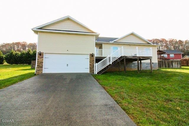 back of property with a yard and a porch