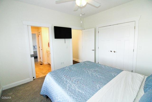 bedroom featuring dark colored carpet and ceiling fan