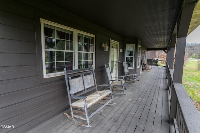 wooden terrace with a porch