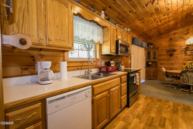 kitchen featuring vaulted ceiling, sink, light hardwood / wood-style flooring, dishwasher, and black / electric stove