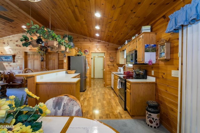 kitchen featuring light hardwood / wood-style floors, wooden ceiling, lofted ceiling, and appliances with stainless steel finishes