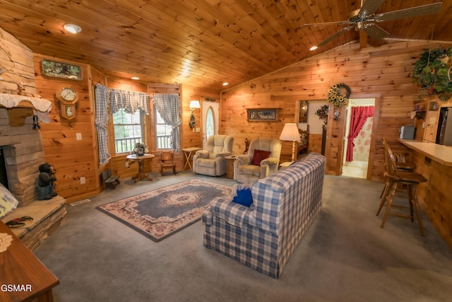 living room featuring wood walls, carpet, wood ceiling, and vaulted ceiling