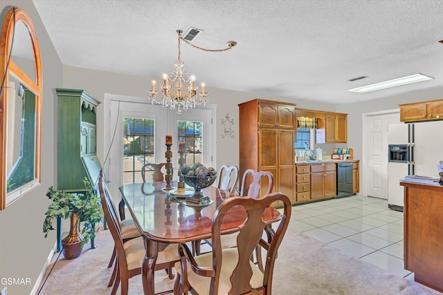 tiled dining area featuring a textured ceiling and an inviting chandelier