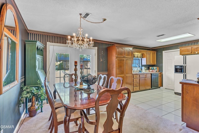 dining area featuring a textured ceiling, a notable chandelier, and light tile patterned flooring