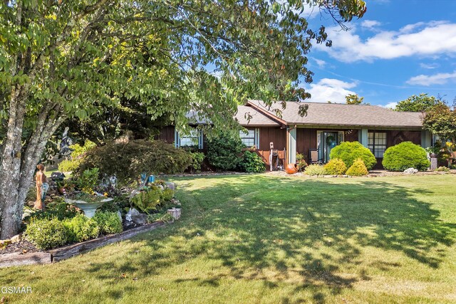 view of front of home with a front lawn