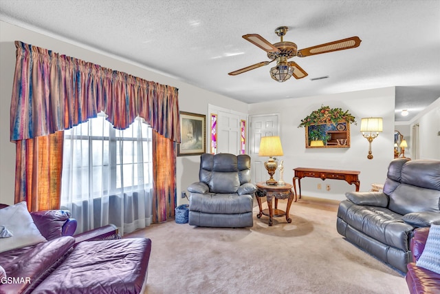 carpeted living room with ceiling fan, a textured ceiling, and billiards