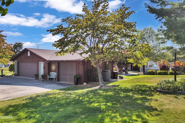 exterior space with a garage and a front lawn