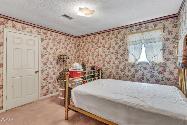 bedroom featuring a textured ceiling