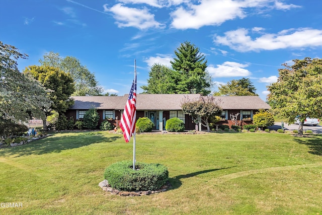 single story home with a front lawn