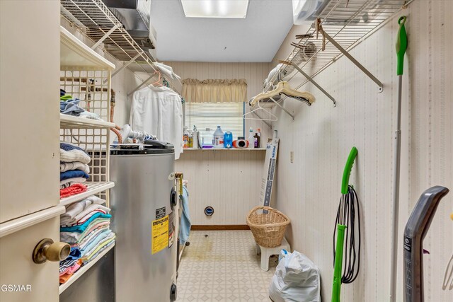 utility room featuring electric water heater