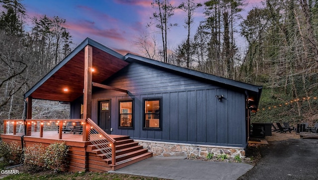 3033 N Clear Fork Rd, Sevierville, TN 37862 - chalet / cabin with a porch and stairs