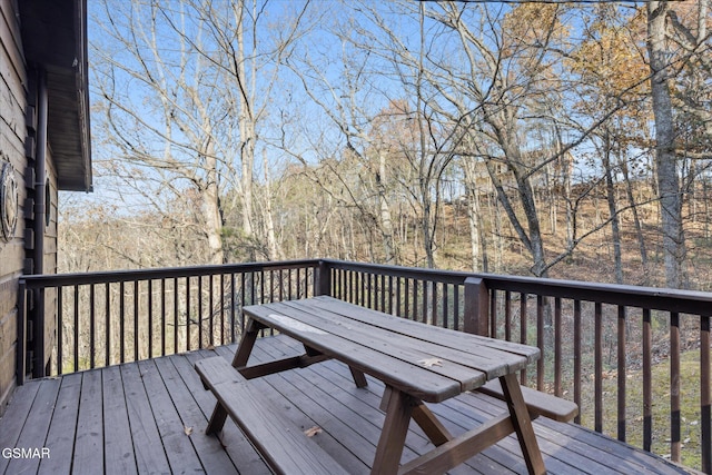 wooden terrace with a forest view