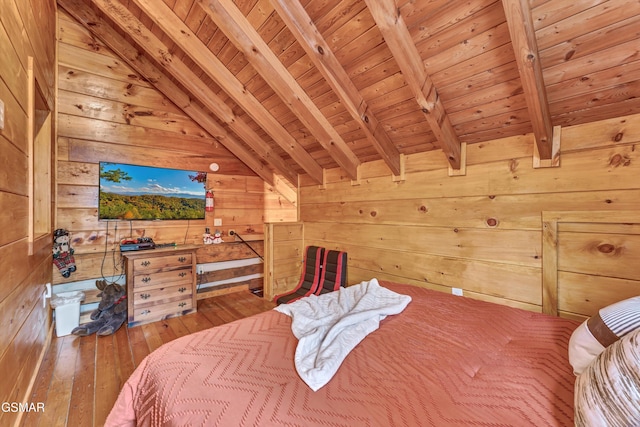 bedroom with vaulted ceiling with beams, hardwood / wood-style flooring, wooden walls, and wood ceiling