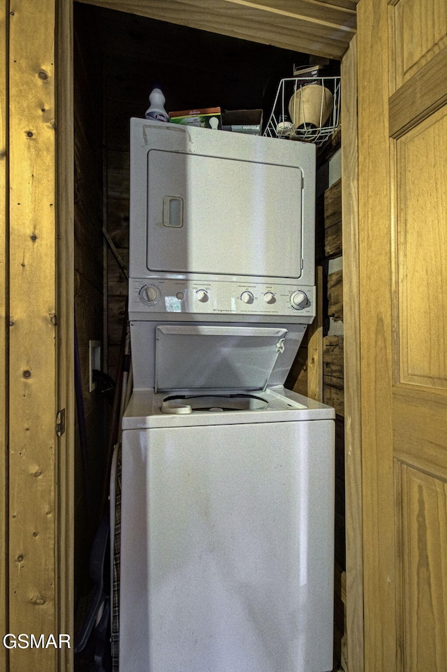 laundry room featuring stacked washing maching and dryer