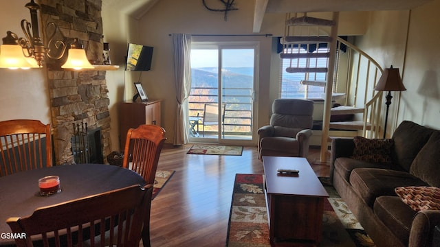 living room with a fireplace and hardwood / wood-style flooring