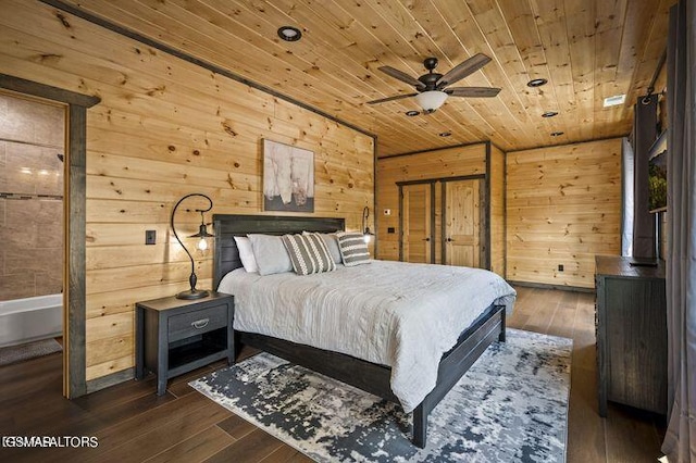 bedroom featuring wooden ceiling, dark wood finished floors, and wooden walls