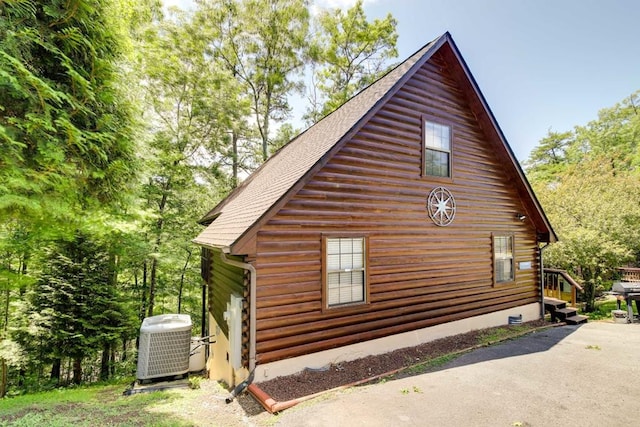 1656 Racoon Den Way, Sevierville, TN 37862 - view of home's exterior featuring log exterior and roof with shingles