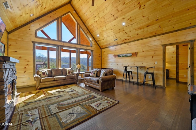 living area with high vaulted ceiling, wood ceiling, wood walls, and wood finished floors