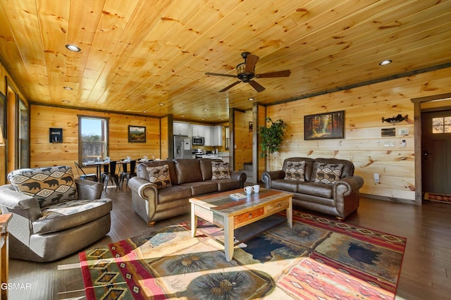 living area with recessed lighting, ceiling fan, wooden walls, wood finished floors, and wooden ceiling