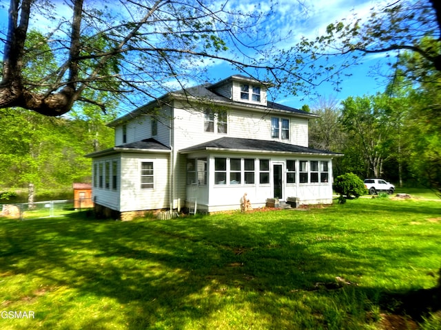 3451 Cosby Hwy, Cosby, TN 37722 - rear view of house featuring a lawn, fence, and a shingled roof